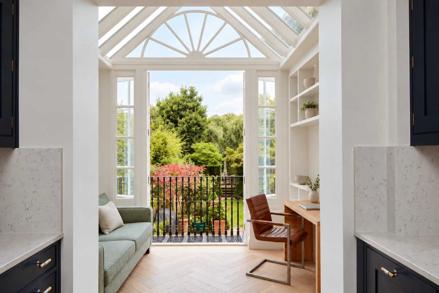 Garden room with a pitched glazed roof, fan-shaped gable, white shelves and an elevated garden view.